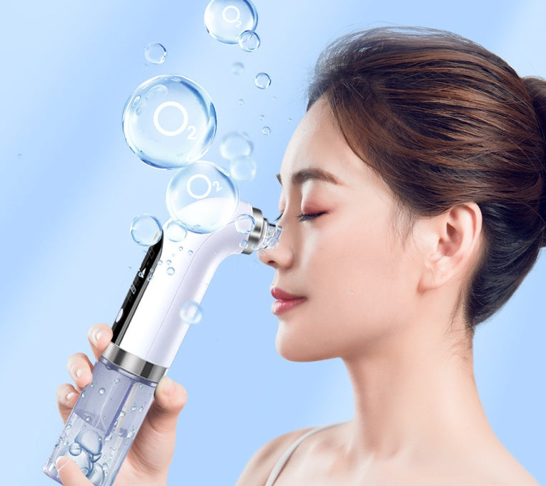 Woman using a Blackhead Vacuum rechargeable pore cleaner tool for skincare.