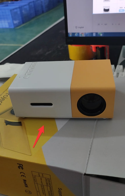 Portable LED projector showing HDMI and USB ports