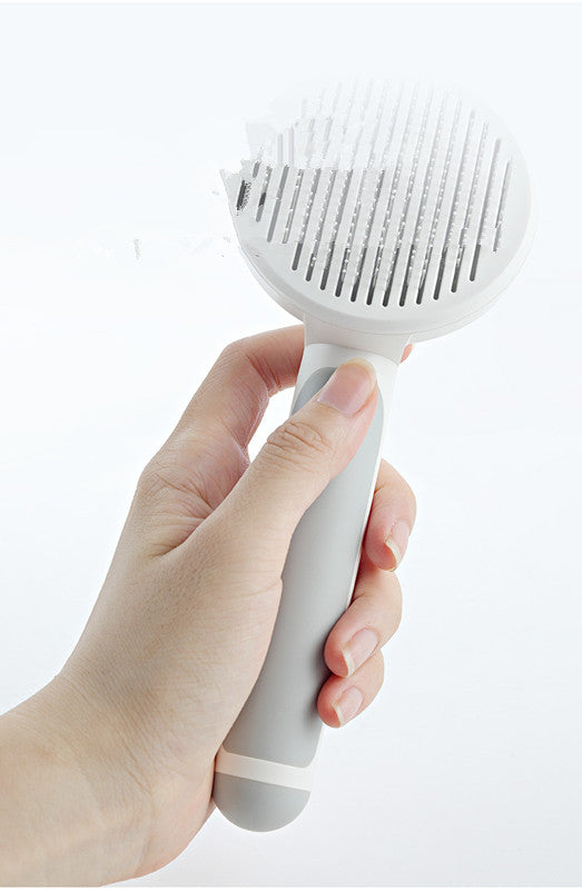pet grooming brush in use on dog removing loose fur