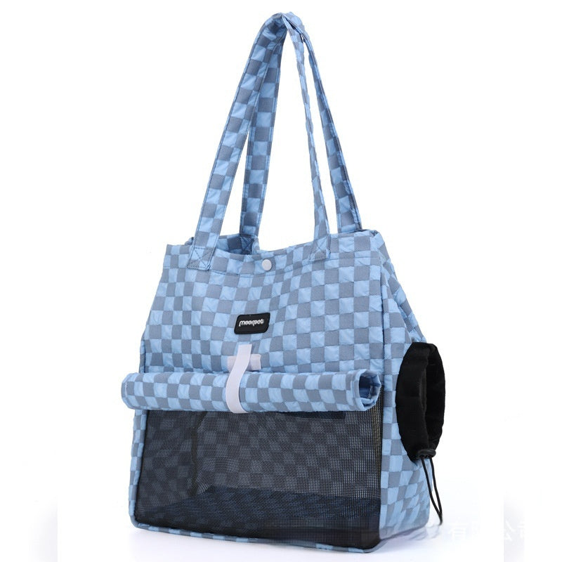 Cat resting inside portable cat carrier bag during travel