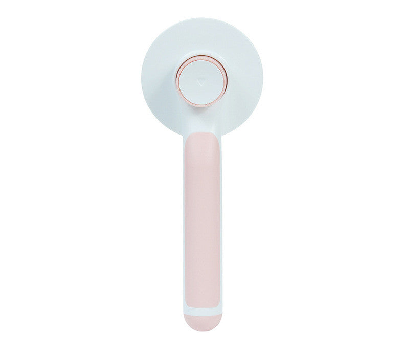 pet grooming brush in use on dog removing loose fur
