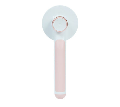 pet grooming brush in use on dog removing loose fur