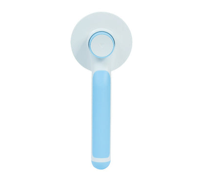 pet grooming brush in use on dog removing loose fur