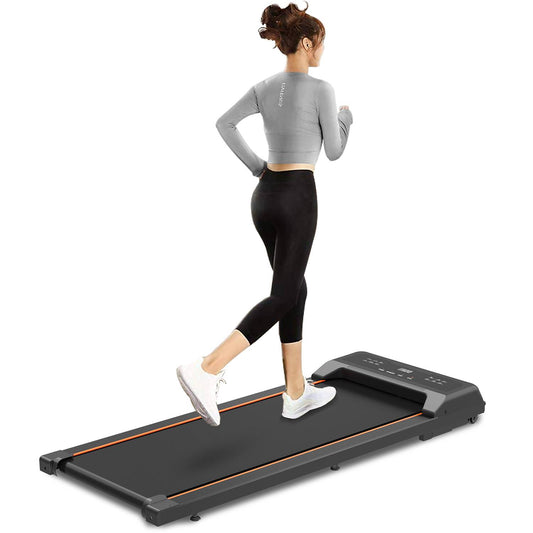 Under desk treadmill in use under office desk