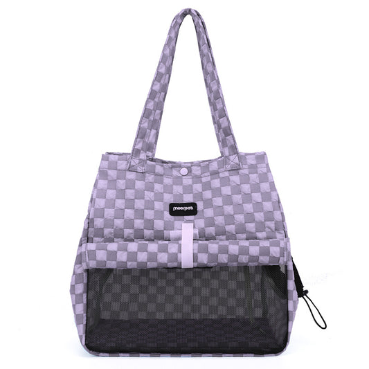 Cat resting inside portable cat carrier bag during travel