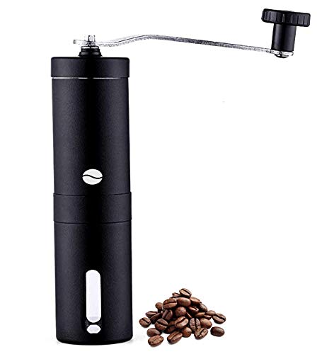 Stainless steel hand coffee grinder beside roasted coffee beans