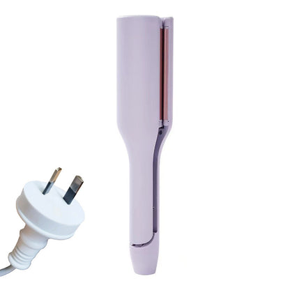hair curling iron creating deep wave hairstyle
