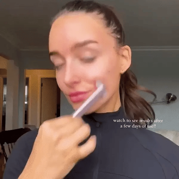 red light therapy wand in use on facial skin