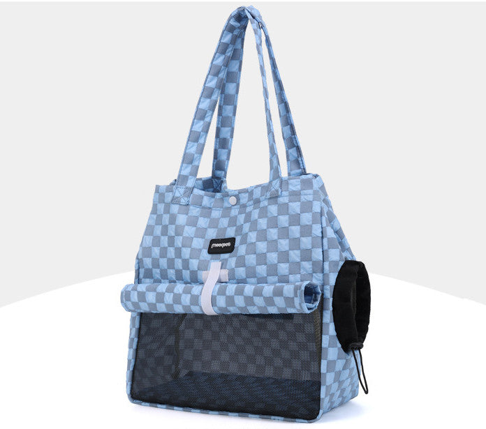 Cat resting inside portable cat carrier bag during travel