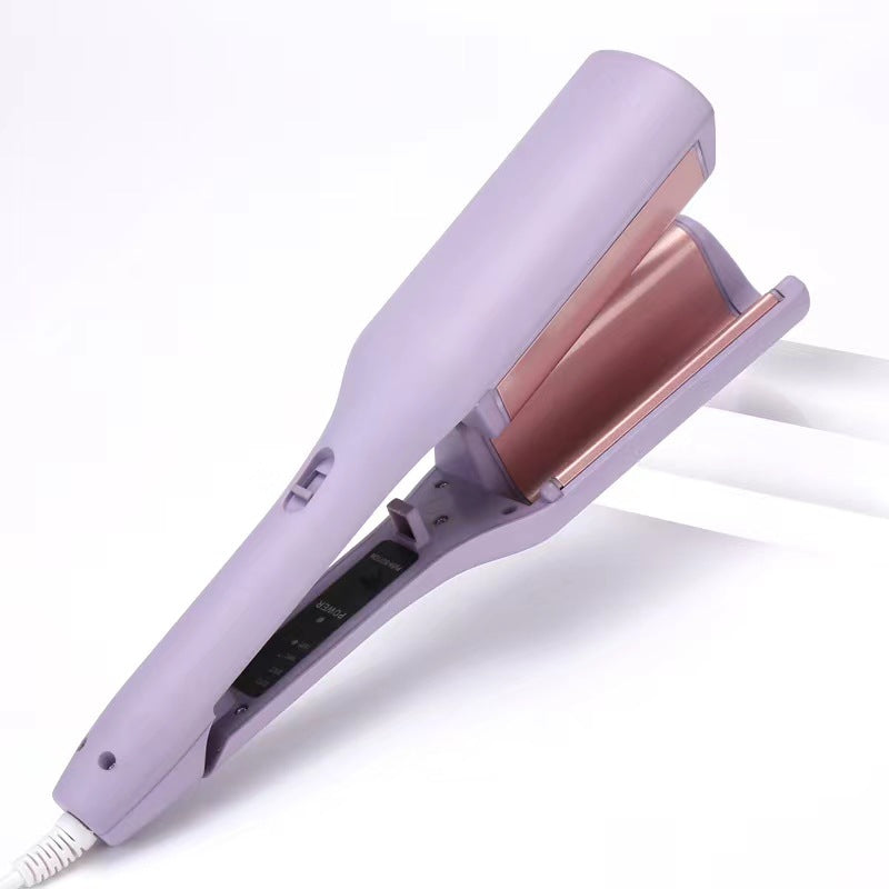 hair curling iron creating deep wave hairstyle